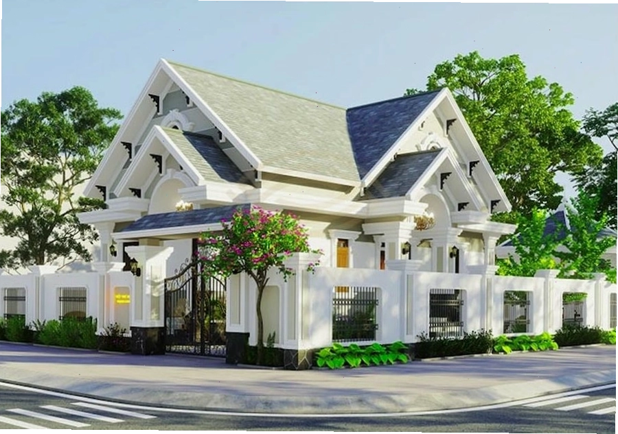 Mẫu nhà vườn mái thái 2 tầng với kiến trúc cân đối và sân vườn xanh mát
