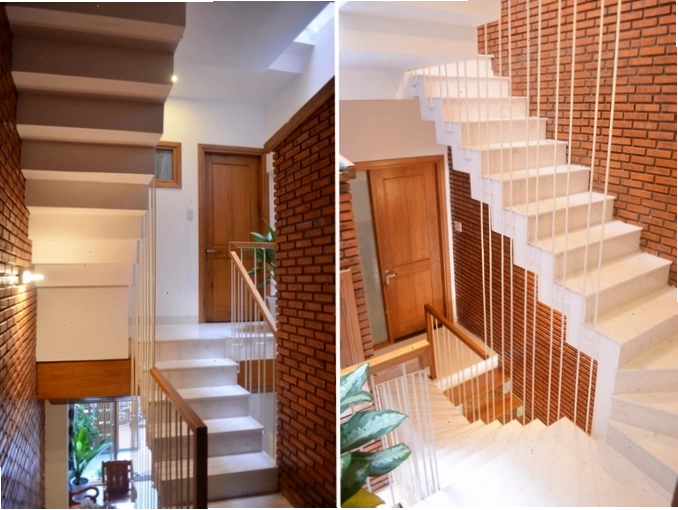 Thiết kế cầu thang kết hợp giếng trời tạo sự thông thoáng cho nhà ống lệch tầng